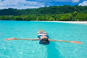 Lengths Prints: Woman floating in the water off Champagne Beach, Espiritu Santo, Sanma Province, Vanuatu