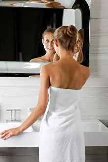Woman getting ready in bathroom