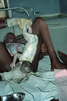 Dispensary Prints: Woman giving birth in a dispensary in Uganda