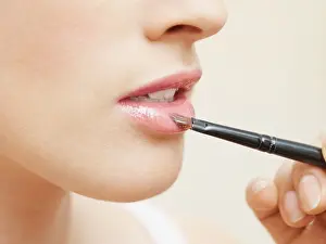 Fashion Model Prints: Woman having lipgloss applied