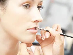 Fashion Model Prints: Woman having lipgloss applied