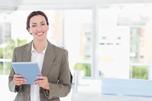 Light Blue Prints: Woman holding light blue tablet in modern bright office