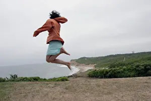 Skirt Prints: woman jumping by lighthouse fun day off recreation joy jumping for joy happy love freedom yeah success complete jump