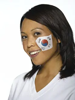 Stare Prints: Woman with Korean flag painted on cheek, close-up