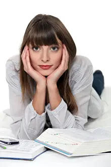 Normal Prints: Woman lying down with reference books