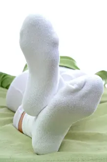 Laziness Prints: Woman lying wearing white socks