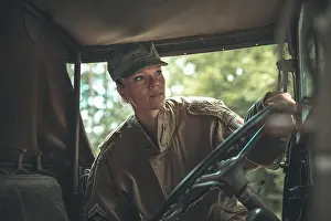 Us Army Prints: woman in a military uniform in an army car