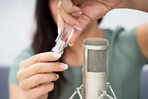 Pleasant Prints: Woman Opening Lipstick On Microphone To Make ASMR Sounds