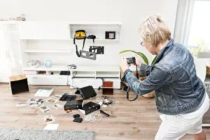 Evidence Prints: Woman photographing chaos after burglary when coming back in her one-family house