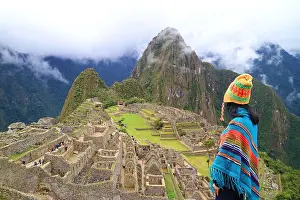 Admiring Prints: Woman in Poncho and Andean Hat Visiting the Amazing Ancient Inca Citadel of Machu Picchu