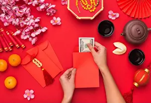 Empty Space Prints: Woman preparing dollars for present on Chinese New Year