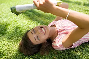 Jolly Prints: Woman reading in the shade, lying on a lawn