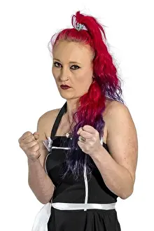 Poses Prints: Woman with red hair and petticoat dress poses with fists raised threateningly