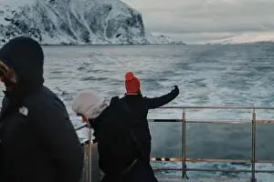 Brim Prints: Woman in red hat taking selfie on arctic ocean tour boat in the Lyngen Alps