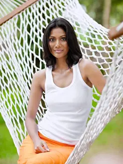 Weekend Activities Prints: A woman relaxes in a hammock at Kairali Ayurvedic Health Resort, Palakkad, Kerala, India