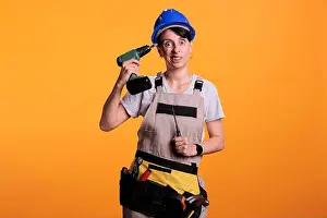 Screw Prints: Woman repair employee holding power drill gun and having fun