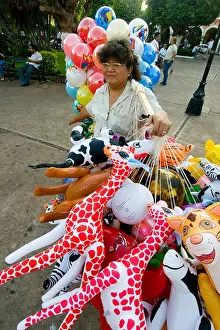 Maya Prints: Woman selling inflatable toys in Merida capital of the Yucatan state Mexico The first Spanish city built in this part