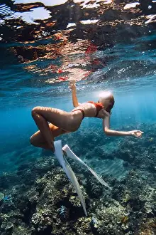 Glides Prints: Woman with sexy body swimming in tropical blue sea. Snorkeling with sexy girl