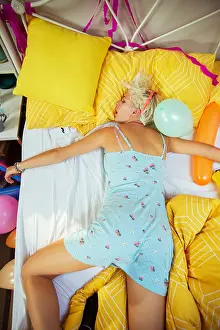 Pajamas Prints: Woman sleeping on bed after party