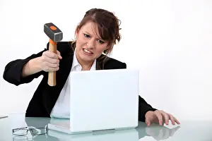 Despair Prints: Woman smashing laptop with hammer