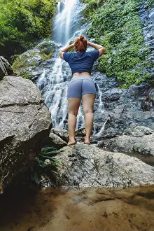 Sabah Prints: Woman standing and looking at Langganan Waterfall, Poring Ranau, Sabah