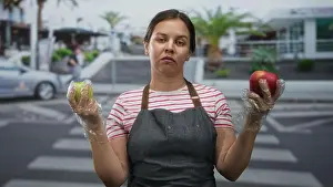 Options Prints: Woman in striped shirt and denim apron holding red