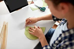 Folding Prints: woman with tablet pc making paper craft at home