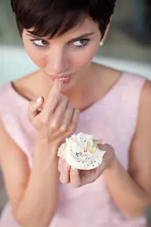 Tasting Prints: woman tasting a cupcake frosting