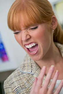 Redhead Prints: Woman with a tension headache