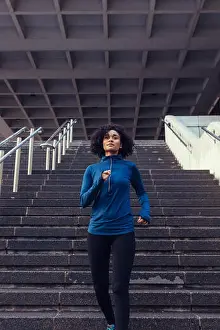 Jogging Prints: Woman in tracksuit running in city