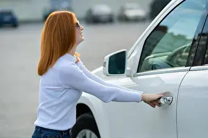 Rental Prints: A woman trying to open closed car doors