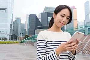 Sending Prints: Woman use of smartphone