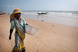 Indian Culture Prints: Woman walking on the beach. Puri, Orissa, India