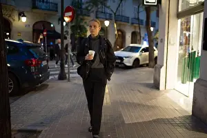 Casual Attire Prints: Woman walking on urban evening street