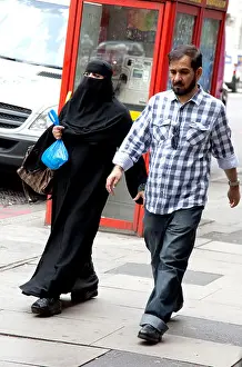 Veil Prints: Woman wearing burqa on London street