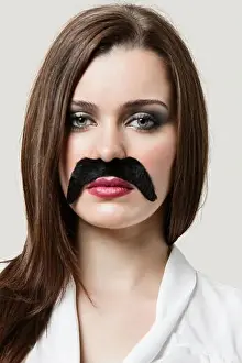 Childish Prints: Woman wearing fake moustache