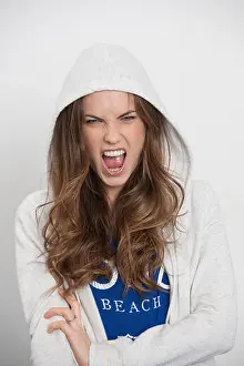 Emotional Expression Prints: woman wearing a hoodie shouting, aggressive expression