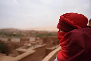 Hijab Prints: woman wearing traditional headwear shesh overlooking morroco desert from Ait Ben Haddou Kasbah