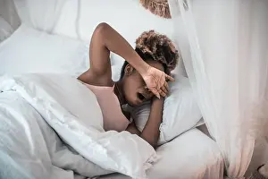 Sleepy Prints: Woman yawning covering her face with hand