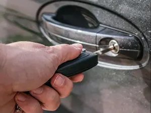 Rental Prints: woman's hand opening a car