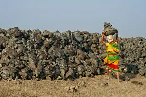 Hardship Prints: Women labourers carrying heavy basket of earth on head West bengle, rural india