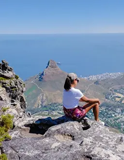 Cape Town Prints: women looking out over the ocean with a view from the Table Mountain in Cape Town South Africa