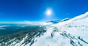 Wonderful giant snowdrifts on the hills in the mountains covered in snow on a sunny frosty winter day