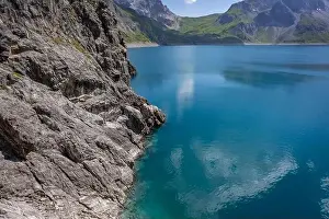 Wonderful landscape at the Luenersee with dam wall and rocks in Vorarlberg, Austria
