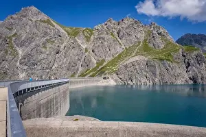 Cable Car Prints: Wonderful landscape at the Luenersee with dam wall and rocks in Vorarlberg, Austria
