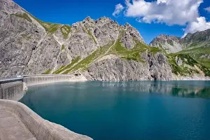 Cable Car Prints: Wonderful landscape at the Luenersee with dam wall and rocks in Vorarlberg, Austria