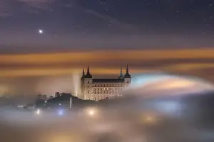 Alcazar De Toledo Prints: From above wonderful landscape of medieval castle built over city in misty colorful sunrise