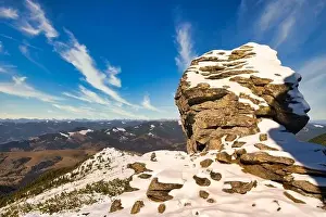 Wonderful landscapes covered with the first snow with large rocky ledges of the Carpathian Mountains
