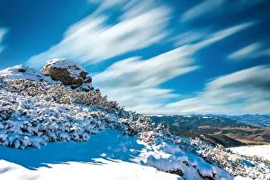 Wonderful landscapes covered with the first snow with large rocky ledges of the Carpathian Mountains