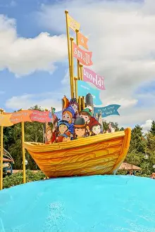 Theme Park Prints: A wooden boat with signs in Disneyland in Paris, France
